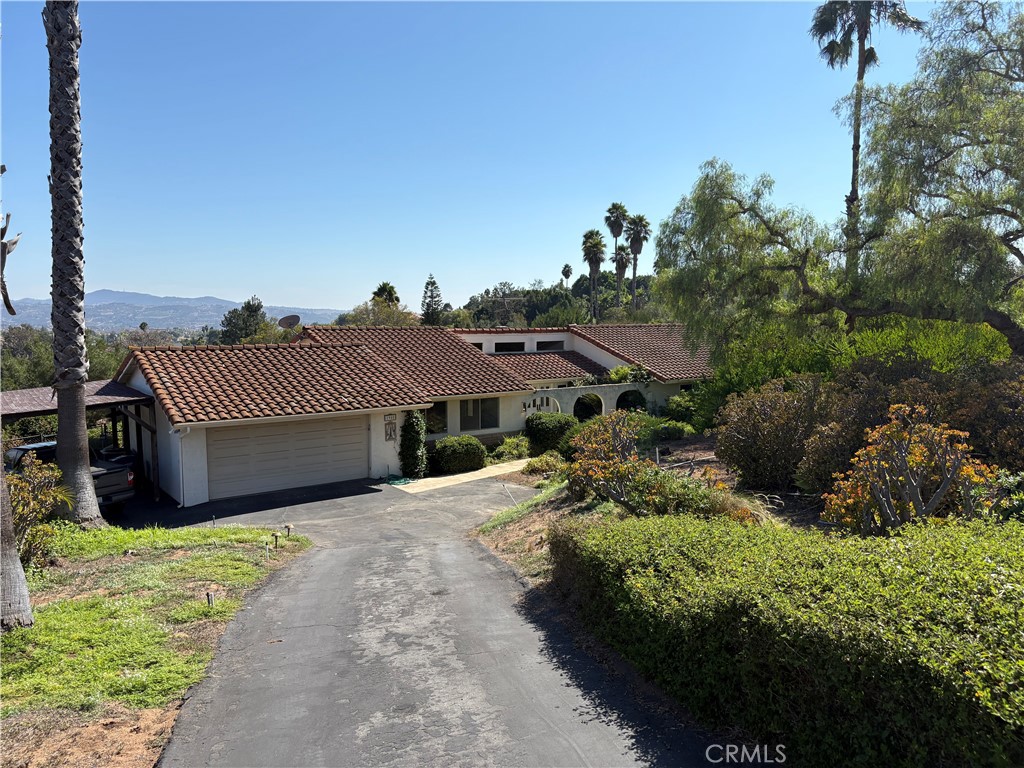 1905 Vista Del Norte Fallbrook, CA 92028 - Photo 7 of 29 a view of a house with a small yard and large tree