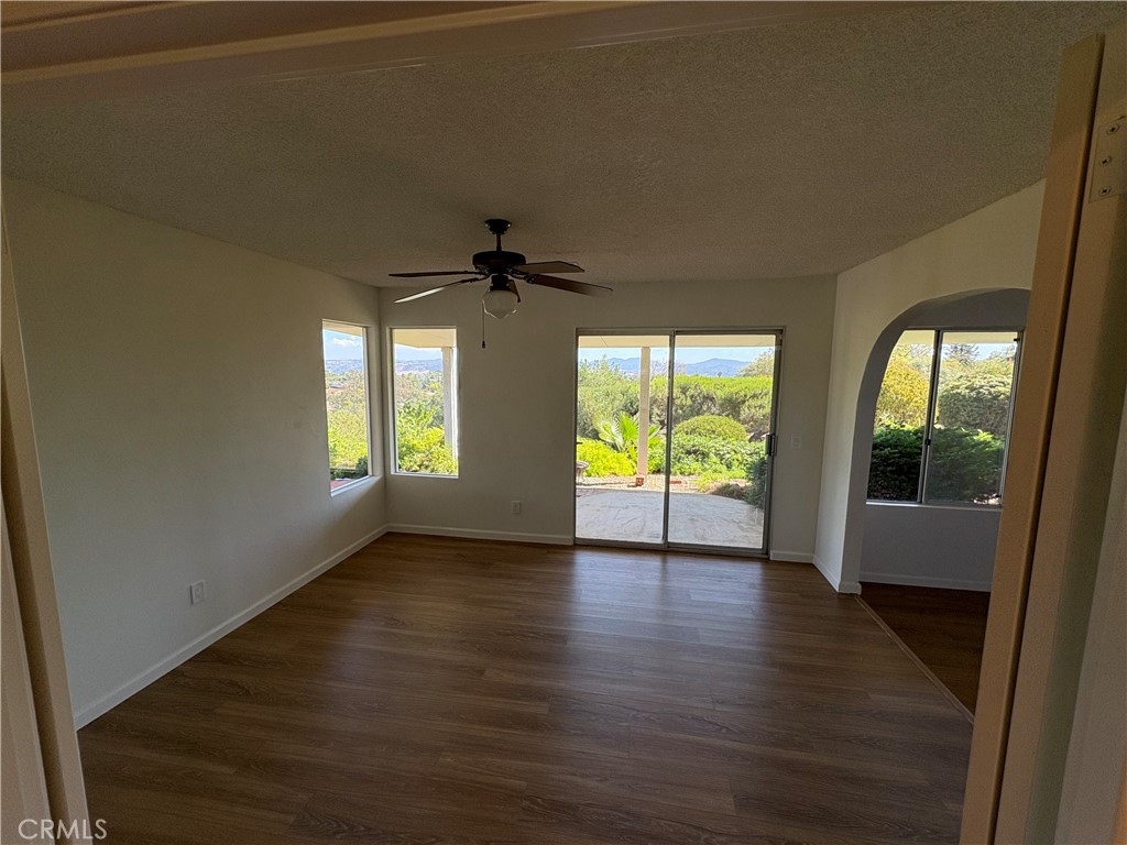 1905 Vista Del Norte Fallbrook, CA 92028 - Photo 10 of 29 a view of an empty room with a window and wooden floor