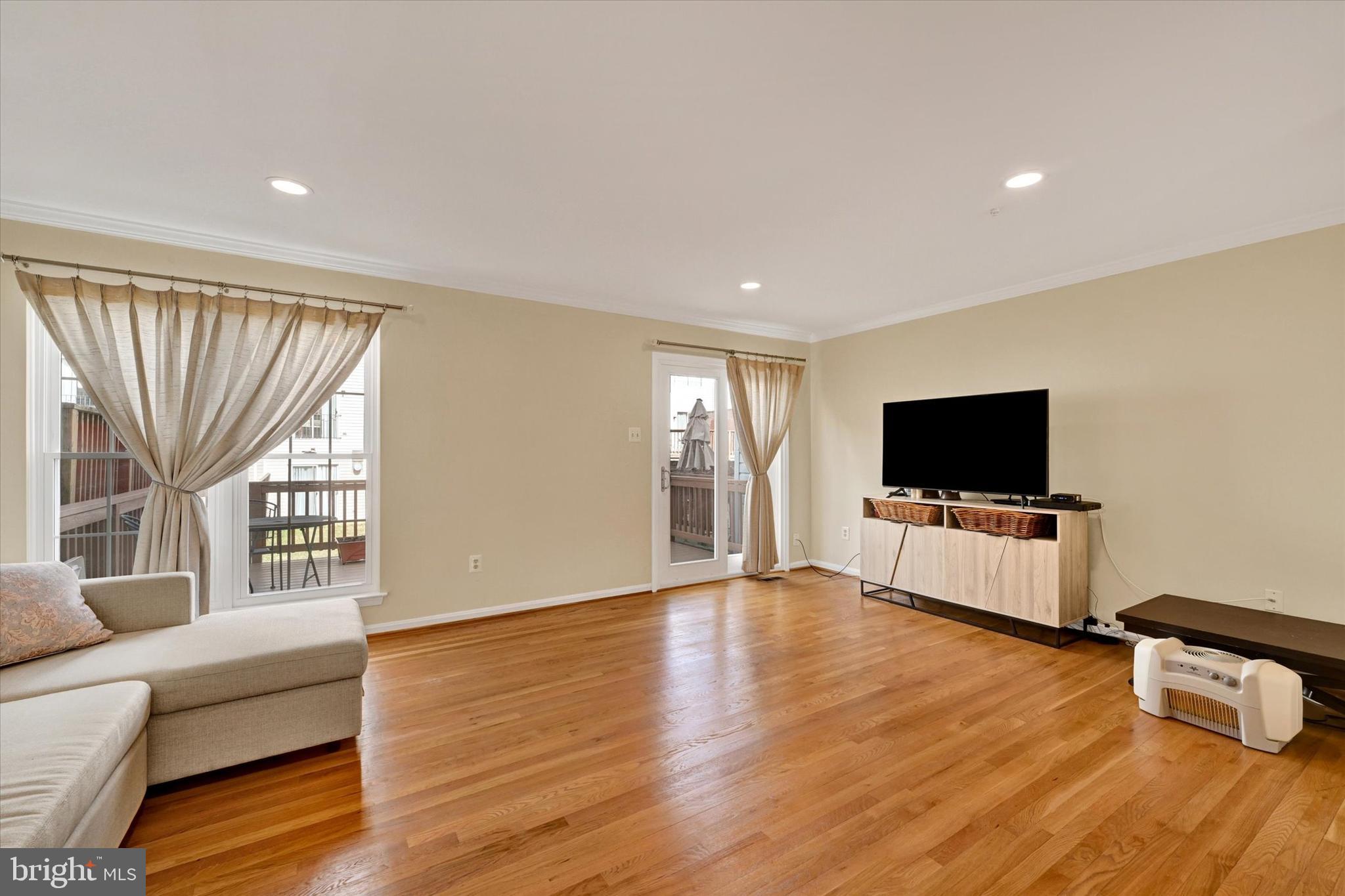 2331 Massanutten Drive Silver Spring, MD 20906 - Photo 11 of 22 a living room with furniture and a flat screen tv