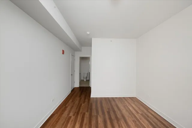 a view of wooden floor in a hallway