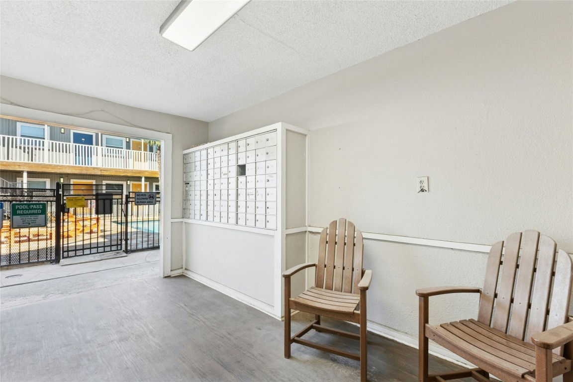 2401 Manor Road, Unit 214 Austin, TX 78722 - Photo 23 of 30 Sitting room with mail area and a textured ceiling