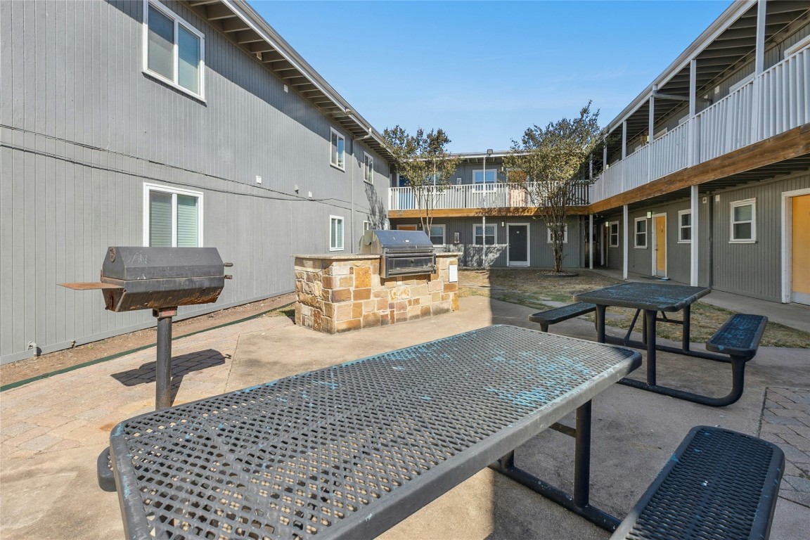 2401 Manor Road, Unit 214 Austin, TX 78722 - Photo 25 of 30 Patio / terrace featuring a patio and an outdoor kitchen