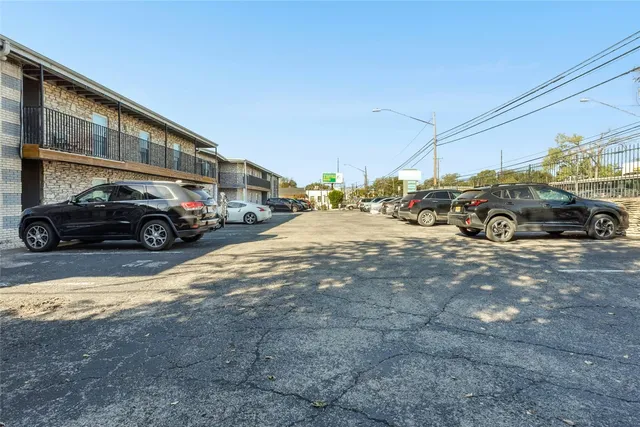 a view of a house with swimming pool and sitting area