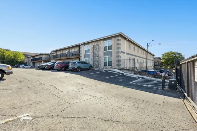 a yellow house sitting in middle of a yard