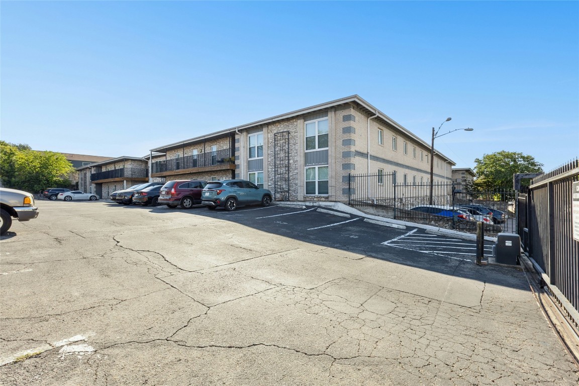 2401 Manor Road, Unit 214 Austin, TX 78722 - Photo 5 of 30 View of uncovered parking lot