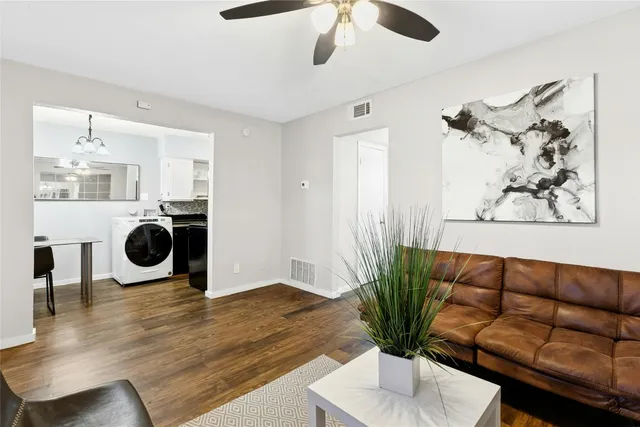 a living room with furniture and a window