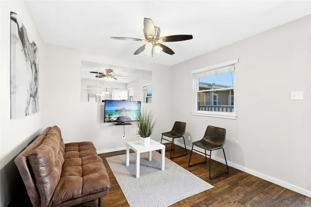 a living room with furniture and a rug