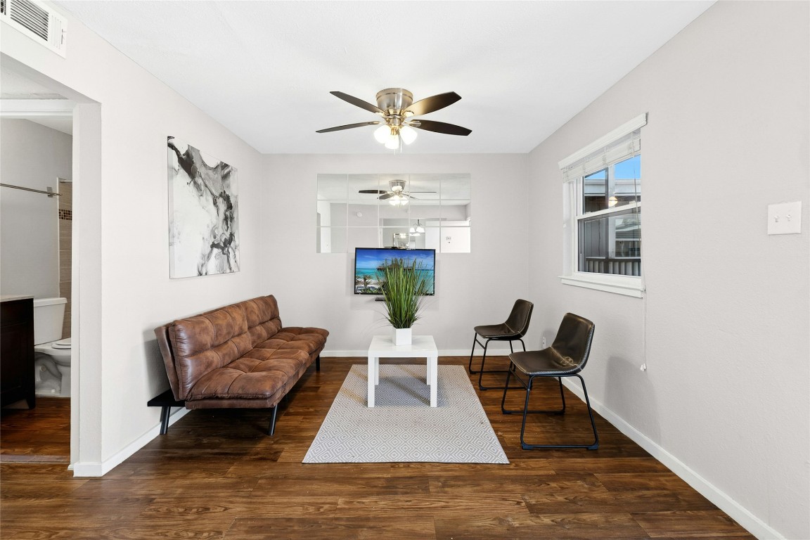 2401 Manor Road, Unit 214 Austin, TX 78722 - Photo 10 of 30 Sitting room featuring dark wood-style flooring and a ceiling fan