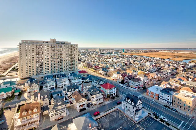 an aerial view of city and lake