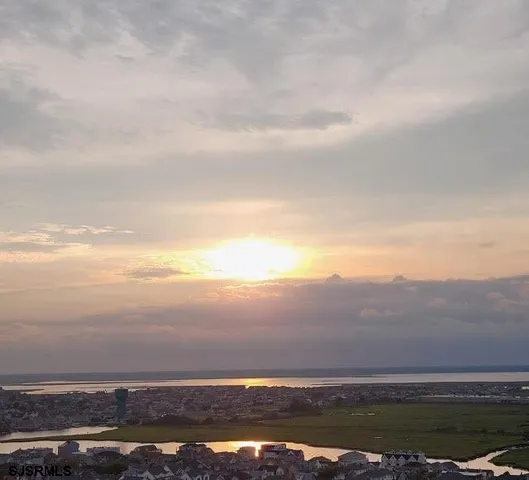 a living room with furniture and painting on the wall