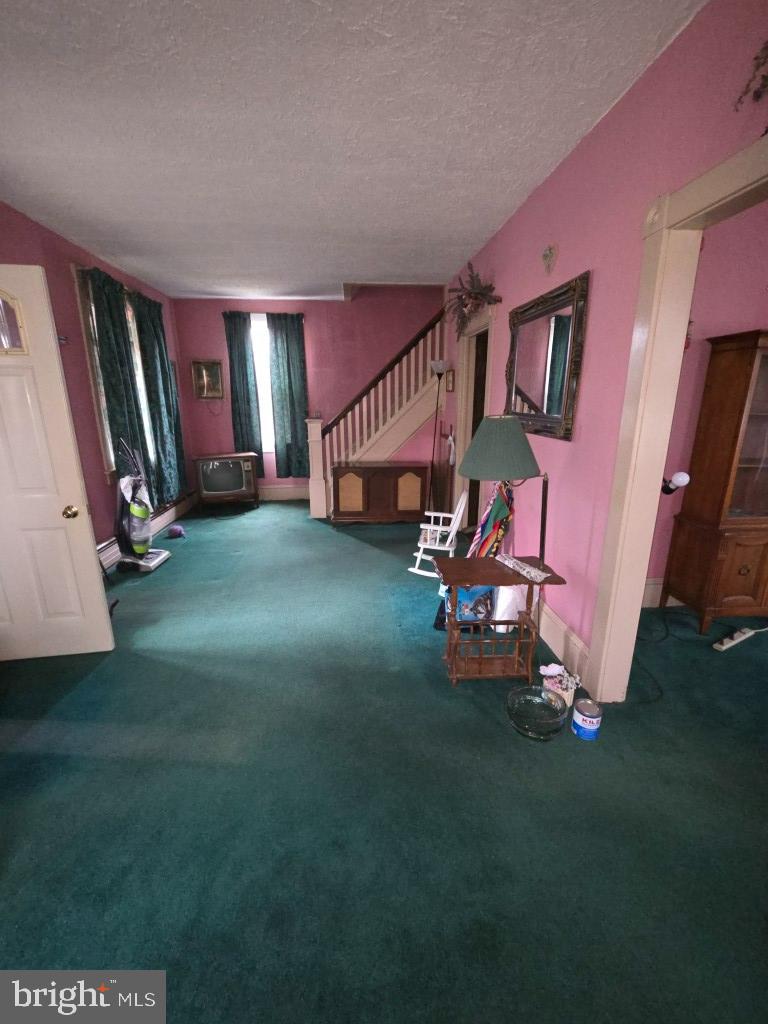 132 Mayfair Road Paxinos, PA 17860 - Photo 12 of 17 a living room with furniture and a flat screen tv