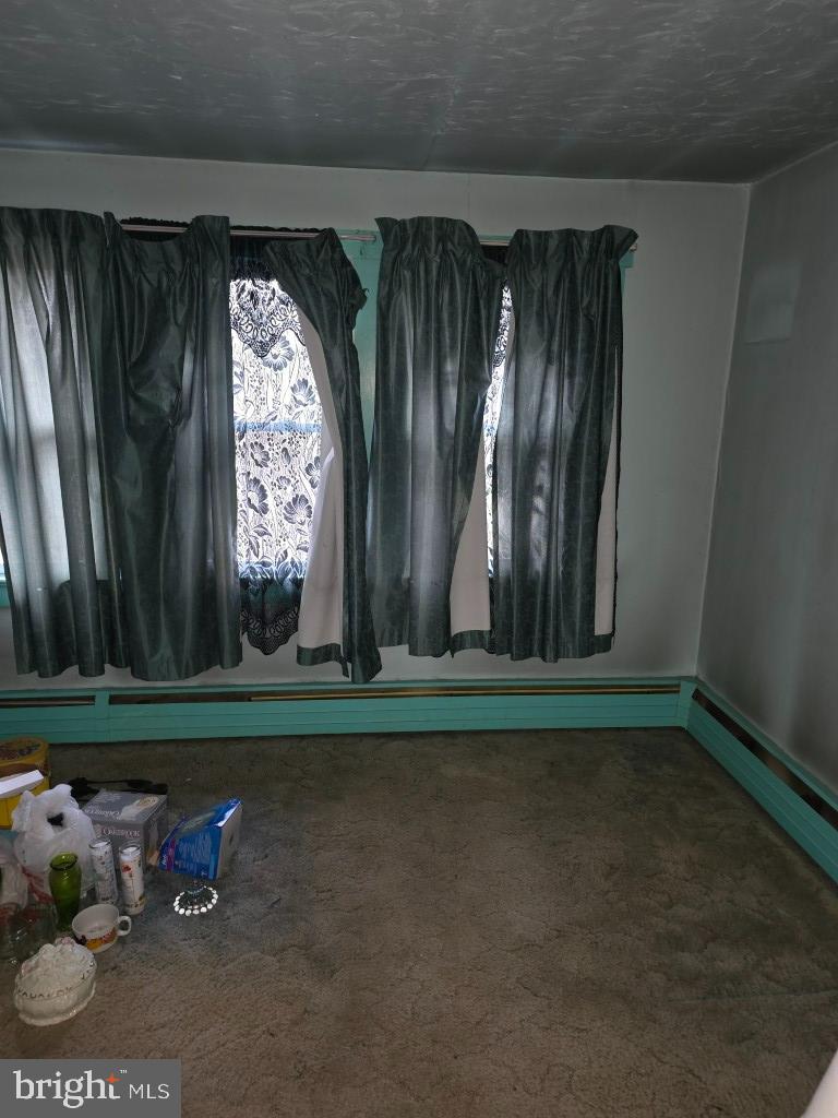 132 Mayfair Road Paxinos, PA 17860 - Photo 9 of 17 a room with a window and a yard