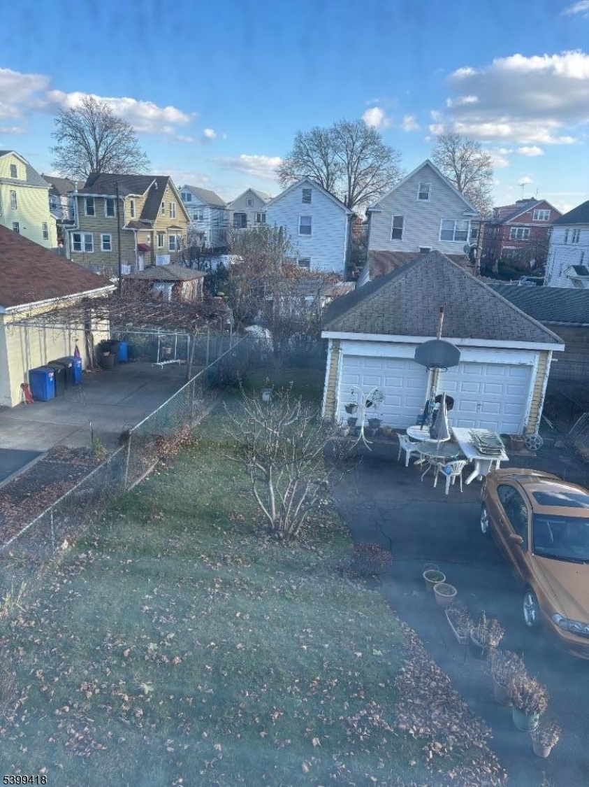 931 Madison Avenue Elizabeth, NJ 07201 - Photo 16 of 23 a view of a house with a yard and sitting area