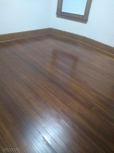 931 Madison Avenue Elizabeth, NJ 07201 - Photo 3 of 23 a view of a room with wooden floor