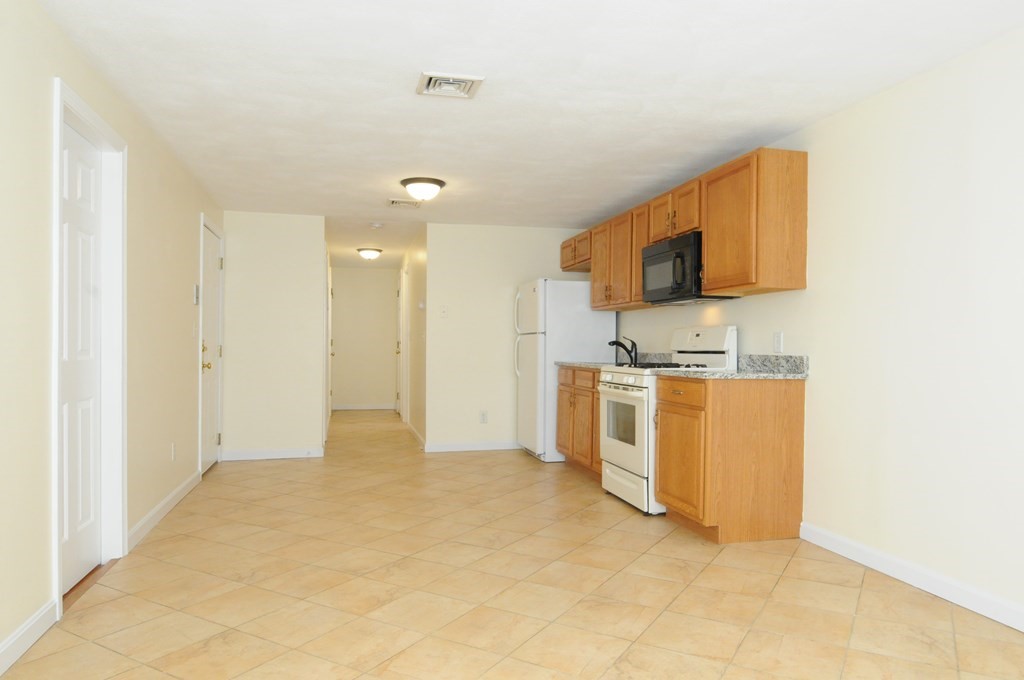 174 Maverick Street, Unit 3 Boston, MA 02128 - Photo 2 of 10 a view of kitchen with sink and microwave