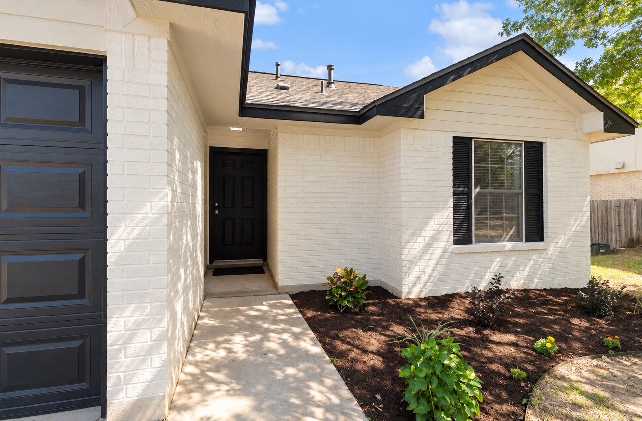 156 Keystone Loop Kyle, TX 78640 - Photo 2 of 23 Crisp masonry siding and a neat concrete walkway establish welcoming curb appeal.