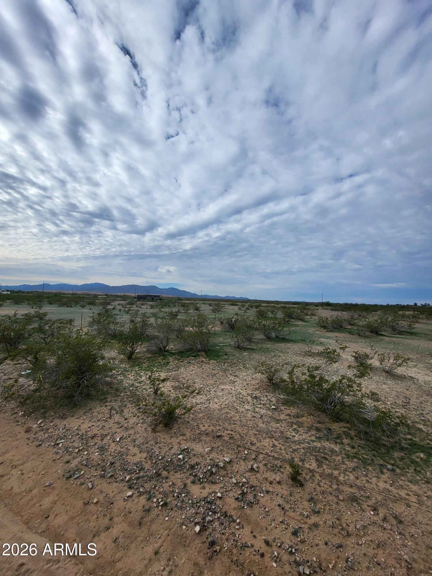 0 186th Surprise, AZ 85387 - Photo 4 of 5 a view of a field with an ocean and trees