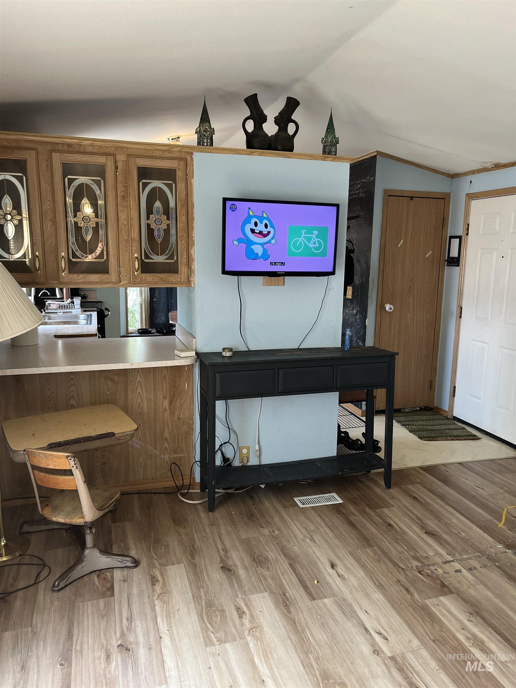 3175 Tomer Road, Unit 36 Moscow, ID 83843 - Photo 4 of 16 Wood-finish flooring with a light wood-tone kitchen cabinetry