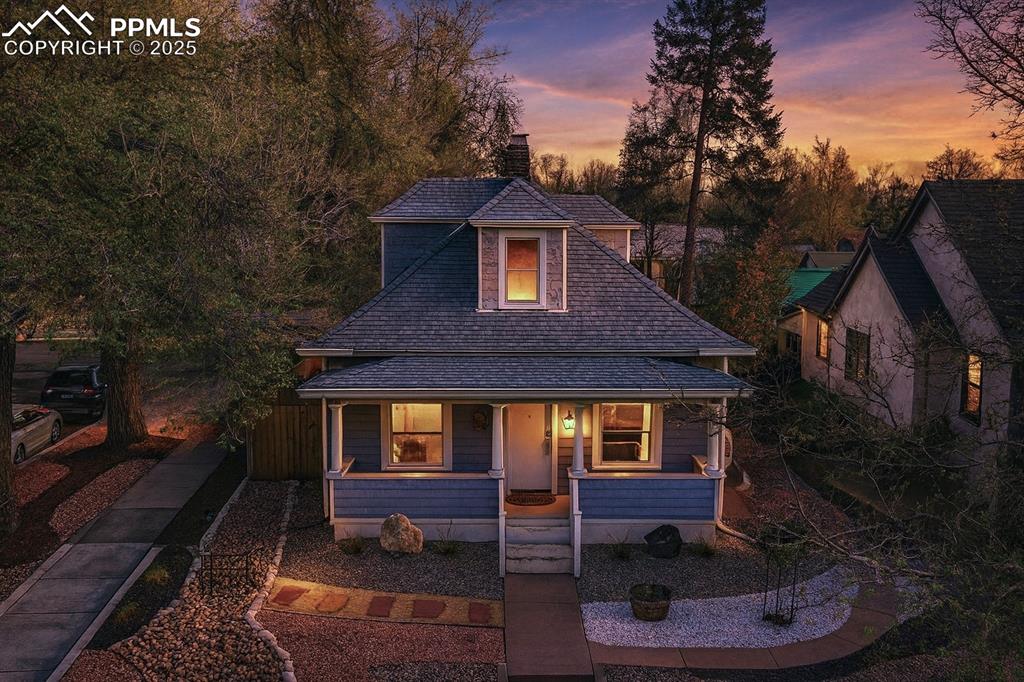 a backyard of a house with a fountain