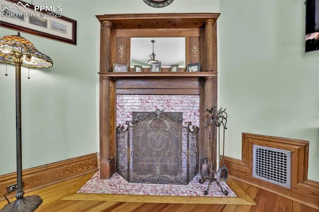 a view of fireplace and wooden floor