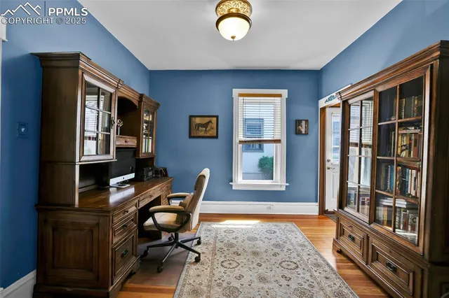 a workspace with furniture and window