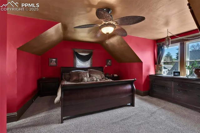 a bed room with a bed and a chandelier