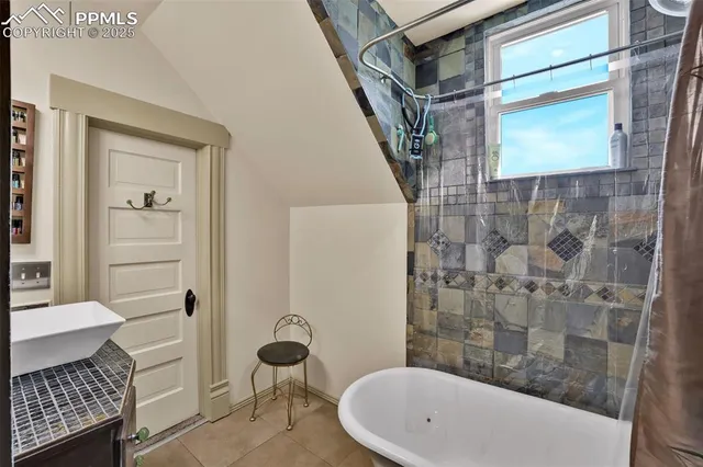a bathroom with a granite countertop toilet a sink and a mirror