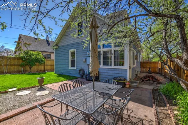 a view of a backyard of the house