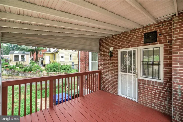 a view of a balcony with wooden floor
