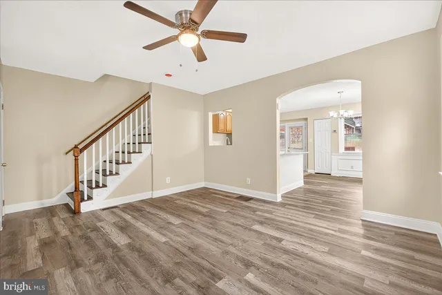 a view of an entryway with wooden floor