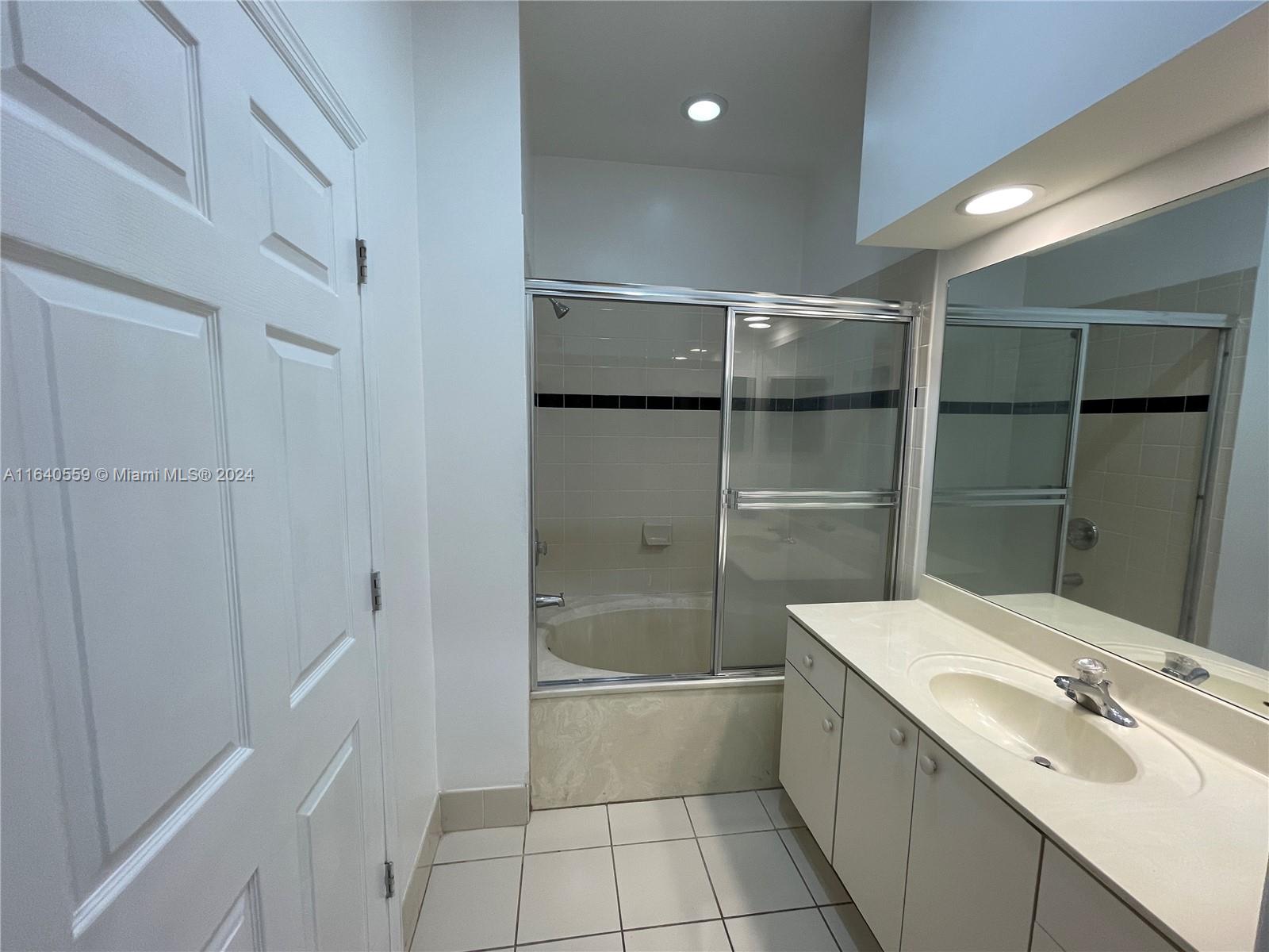 23852 Southwest 109th Place Homestead, FL 33032 - Photo 13 of 19 a bathroom with a sink a toilet and shower