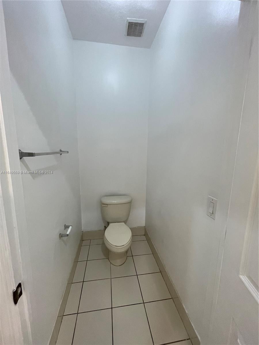 23852 Southwest 109th Place Homestead, FL 33032 - Photo 14 of 19 a bathroom with a toilet and a shower