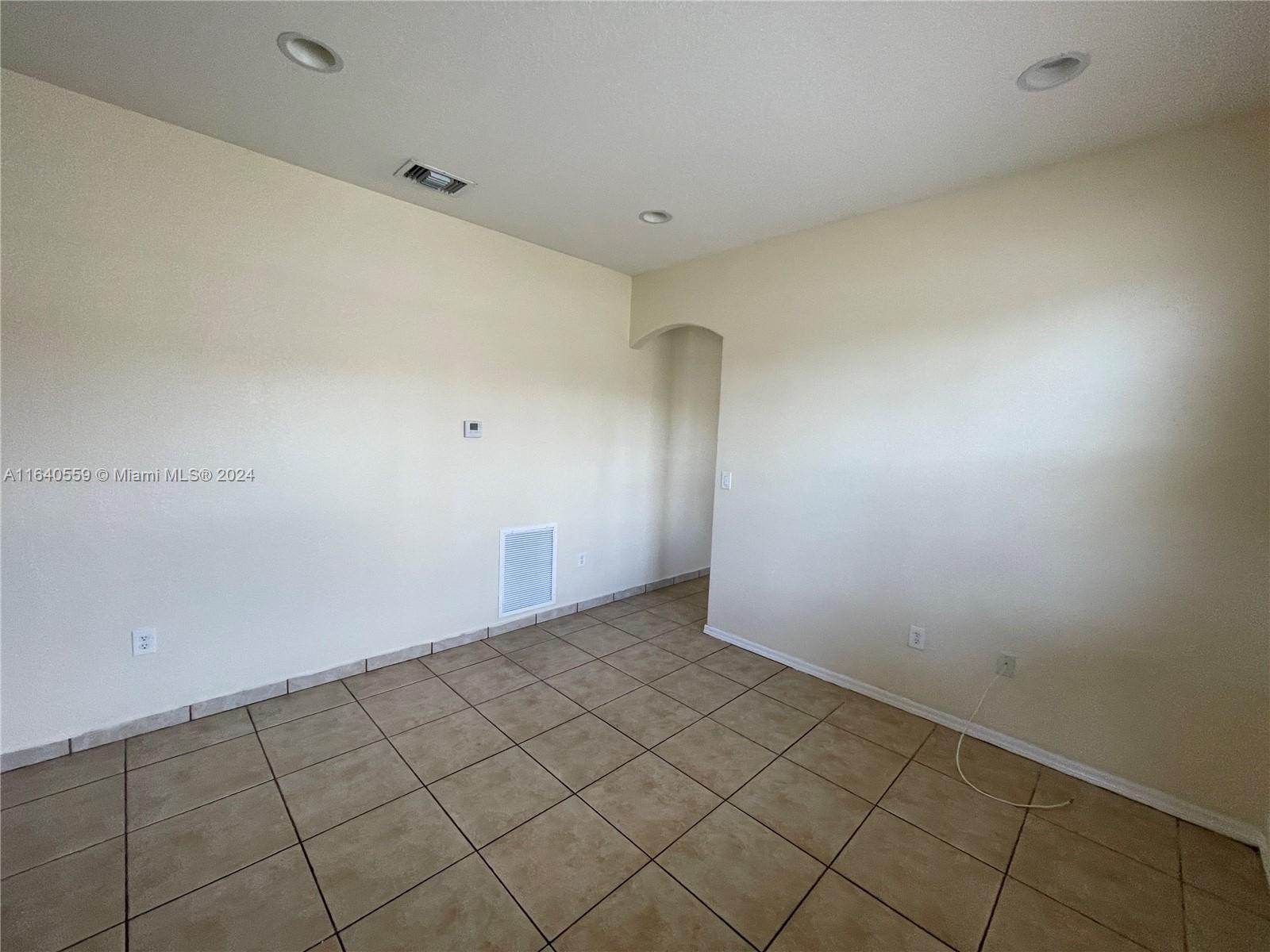 23852 Southwest 109th Place Homestead, FL 33032 - Photo 5 of 19 a view of an empty room