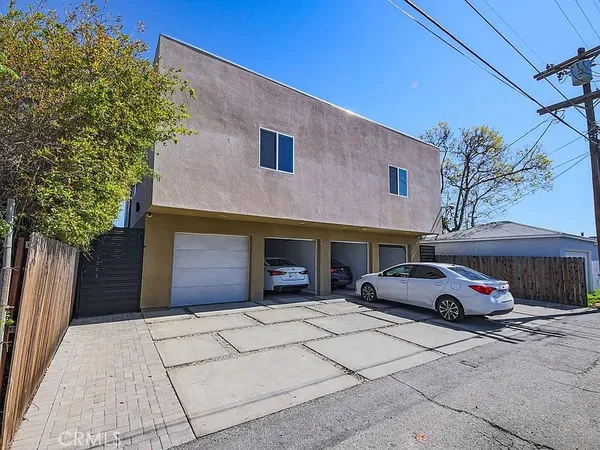 a front view of a building with parking space