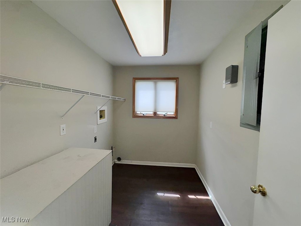 6224 Reynolds Road Mentor, OH 44060 - Photo 10 of 29 Washroom with washer hookup, electric panel, dark wood-style floors, and electric dryer hookup