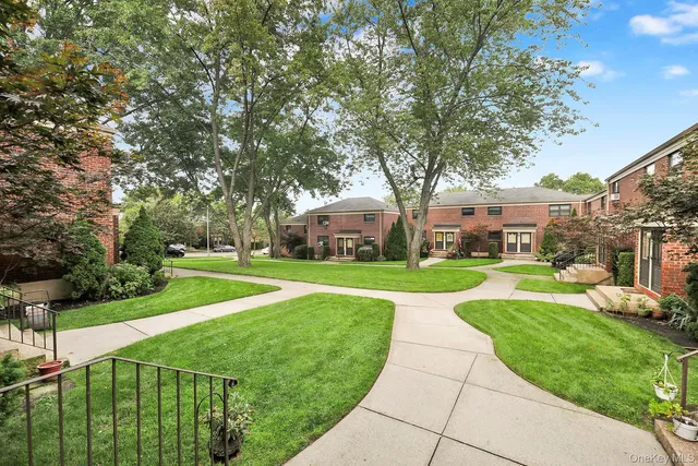 a view of a park with large trees