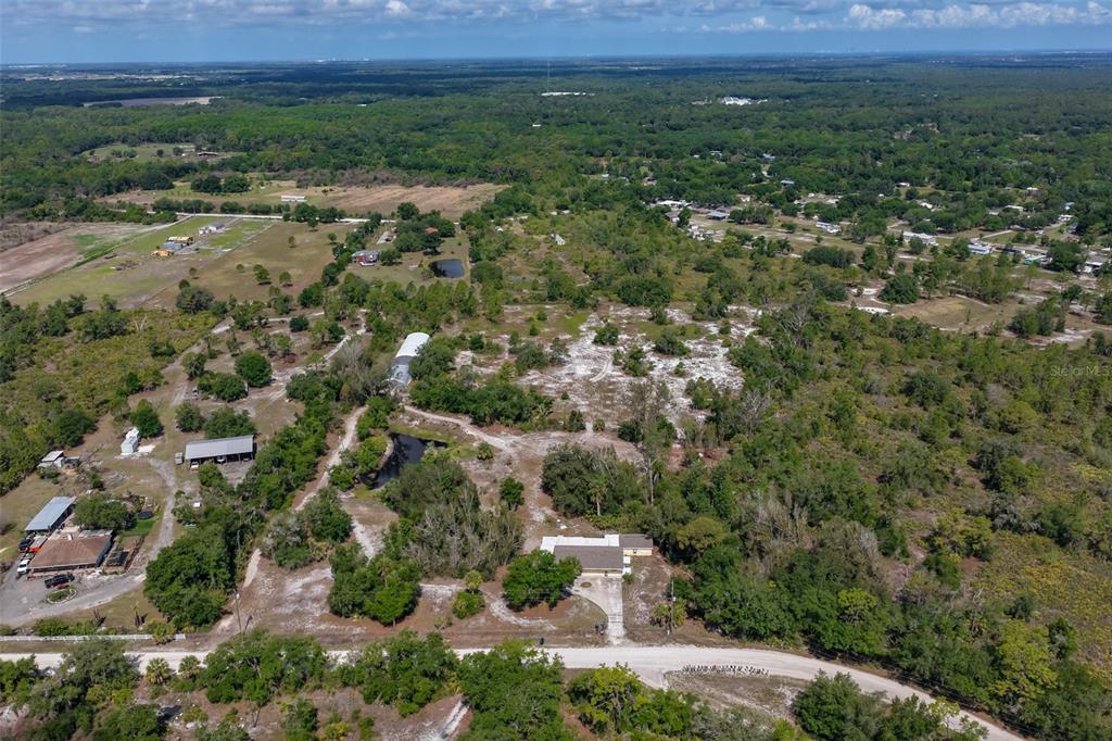 14451 Highland Road Wimauma, FL 33598 - Photo 73 of 80 an aerial view of residential house and green space