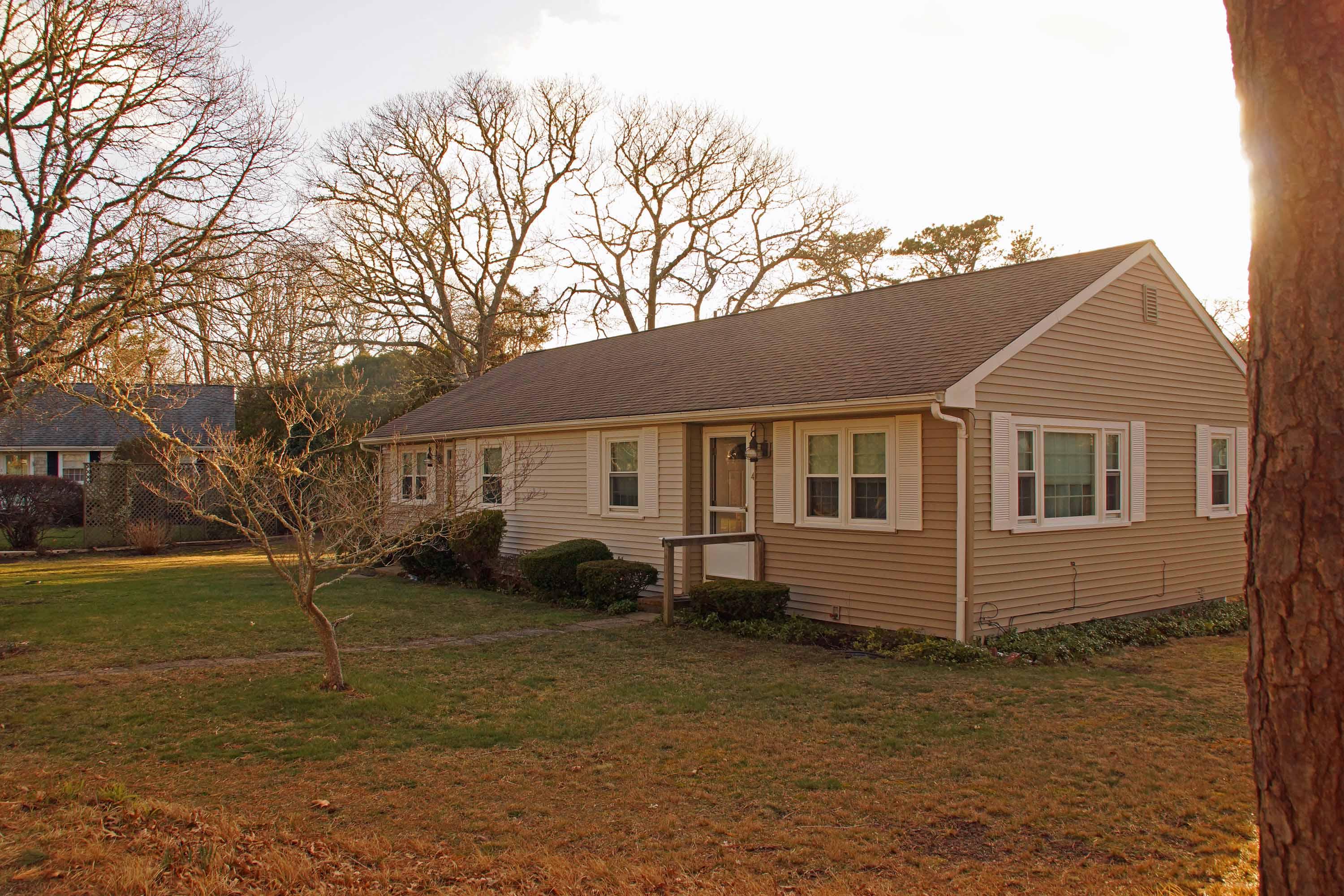 2 Riverside Terrace West Harwich, MA 02671 - Photo 2 of 15 a front view of a house with a yard