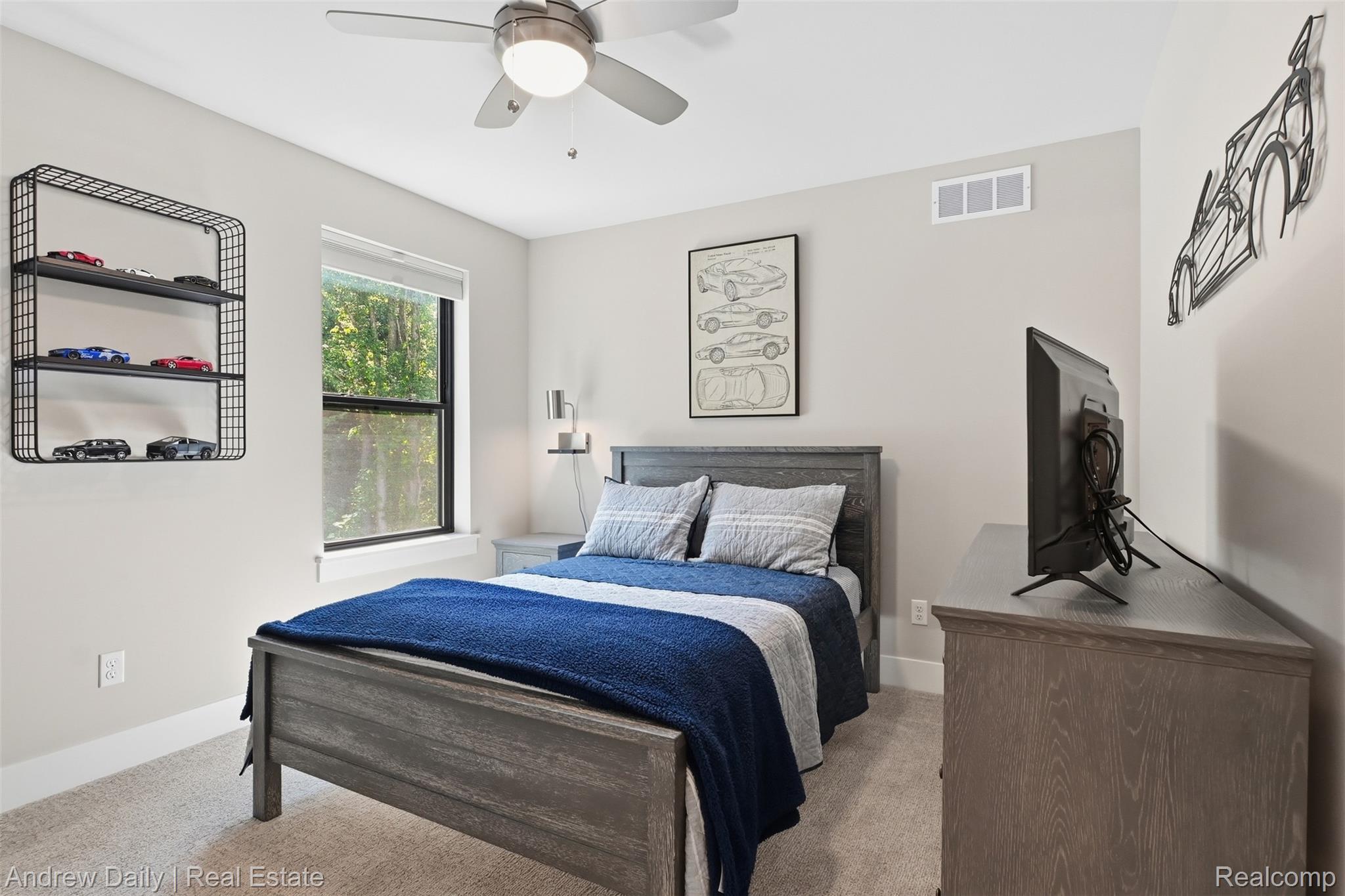4661 Spears Road Pinckney, MI 48169 - Photo 32 of 56 Bedroom featuring a ceiling fan with integrated lighting, a window with exterior tree-line scenery, and light-colored wall-to-wall carpeting