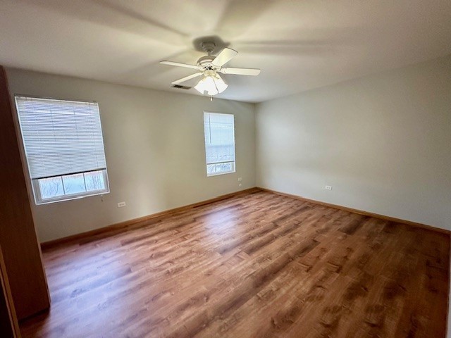 2446 Oak Tree Lane, Unit 2446 Plainfield, IL 60586 - Photo 10 of 11 a view of empty room with window