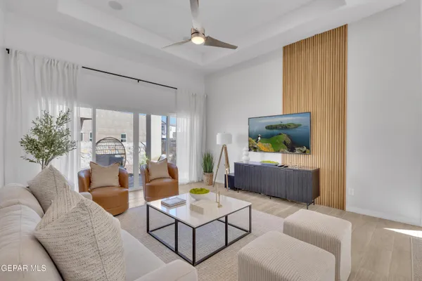 a living room with furniture and a flat screen tv