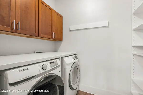 a utility room with dryer and washer