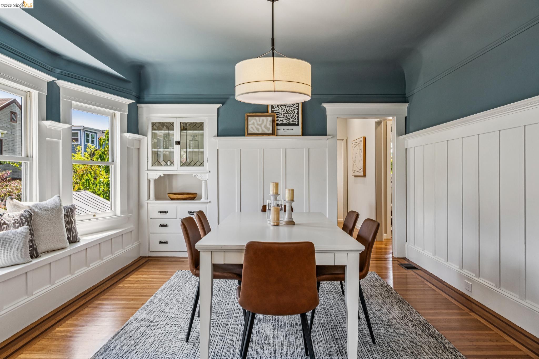 6521 Dover Street Berkeley, CA 94703 - Photo 17 of 80 Dining area with wood-finish flooring, a built-in window seat, and wainscoting