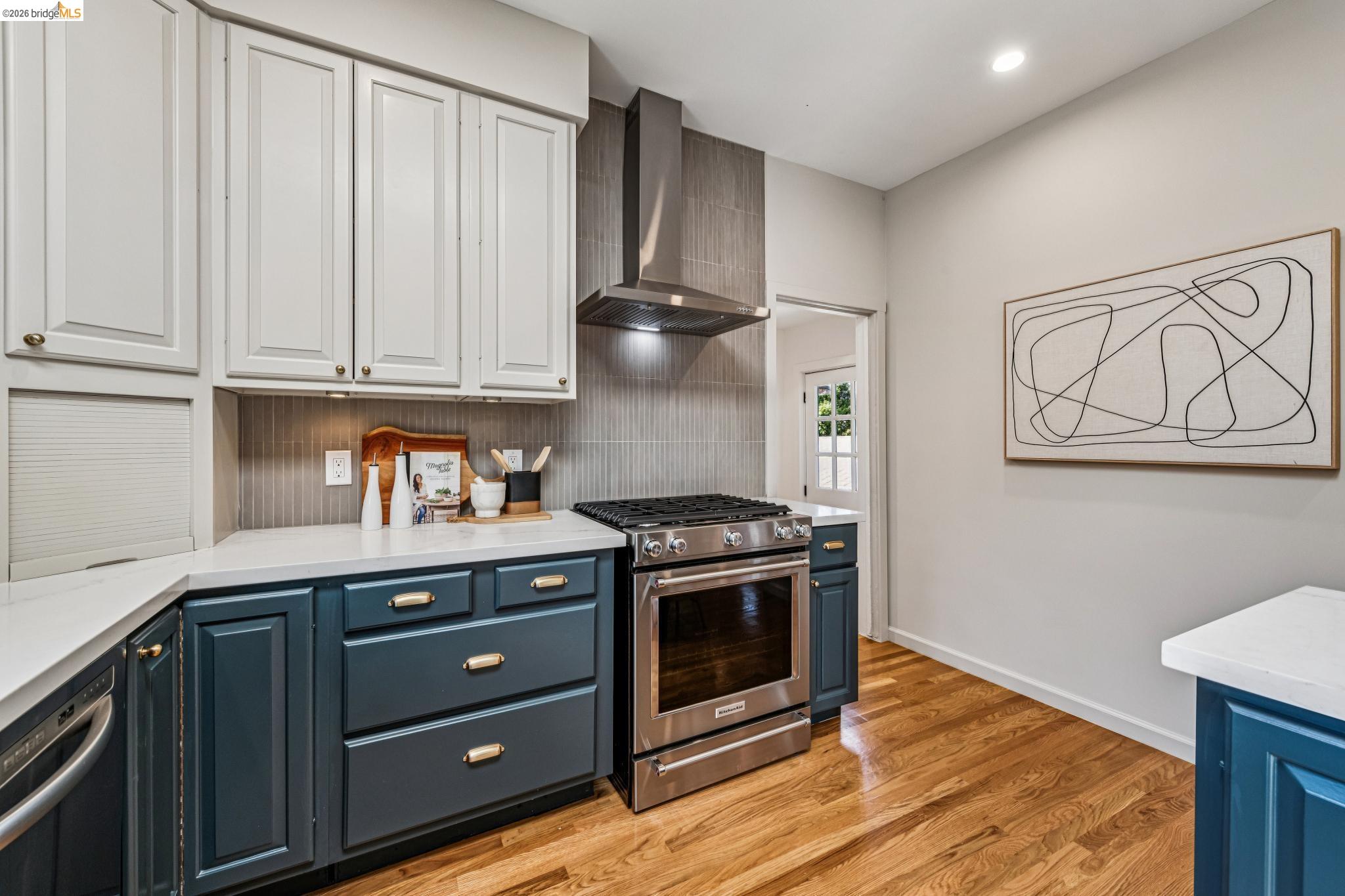 6521 Dover Street Berkeley, CA 94703 - Photo 23 of 80 Kitchen featuring two-tone cabinetry with white upper cabinets and navy lower cabinets