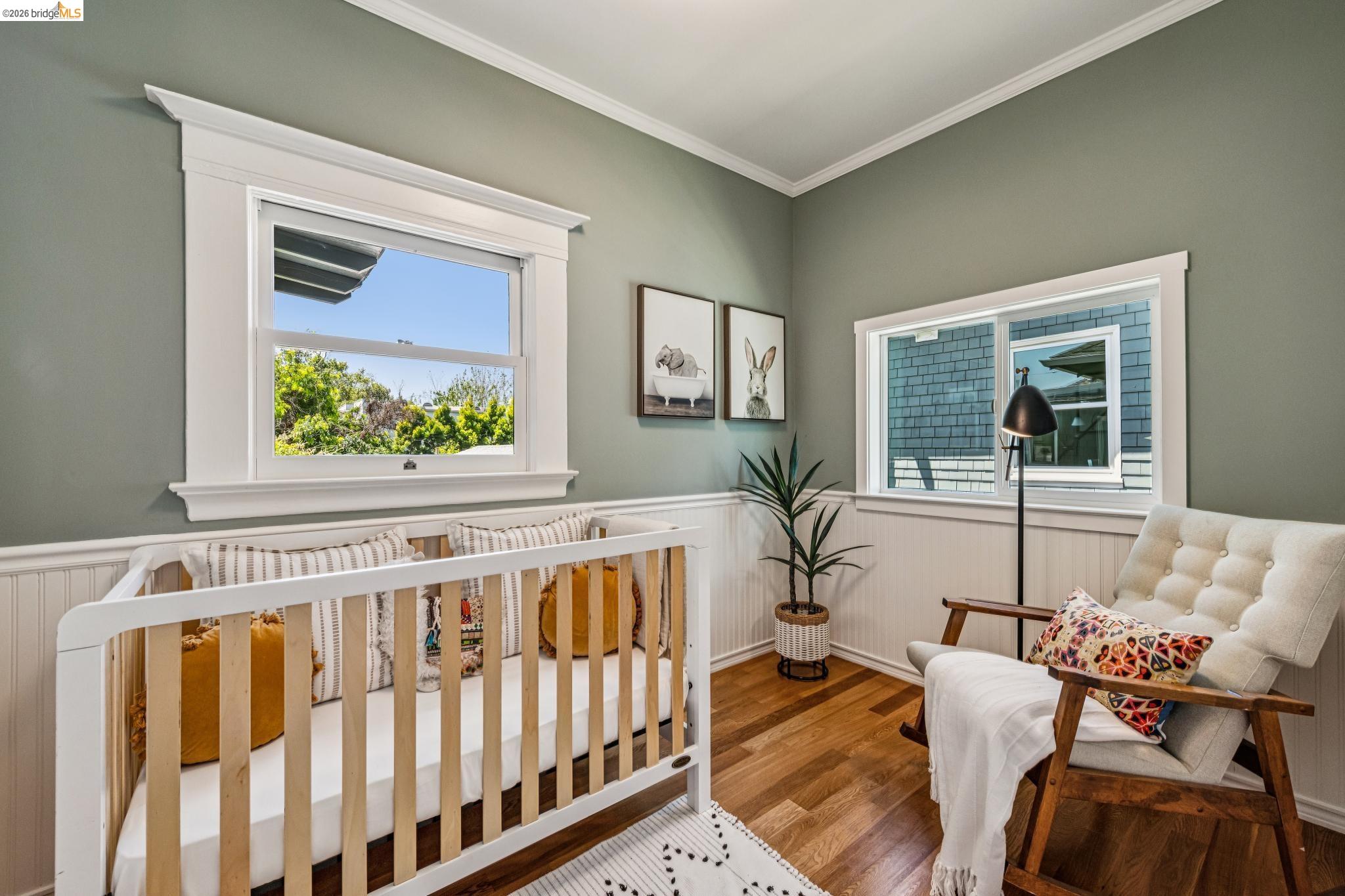6521 Dover Street Berkeley, CA 94703 - Photo 27 of 80 Hardwood flooring with white wainscoting and crown molding