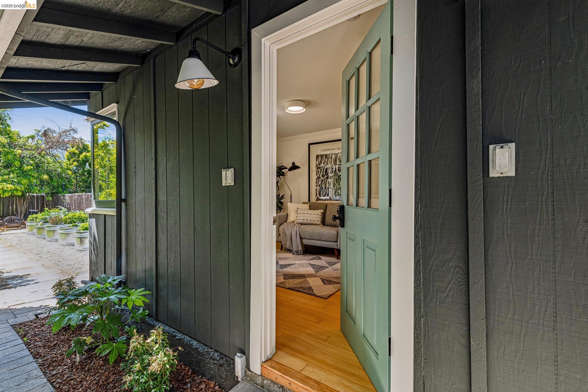 6521 Dover Street Berkeley, CA 94703 - Photo 37 of 80 Board and batten exterior siding with a light green paneled entry door