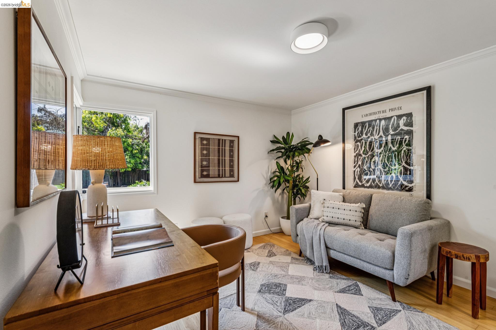 6521 Dover Street Berkeley, CA 94703 - Photo 40 of 80 Hardwood flooring complements white walls and crown molding