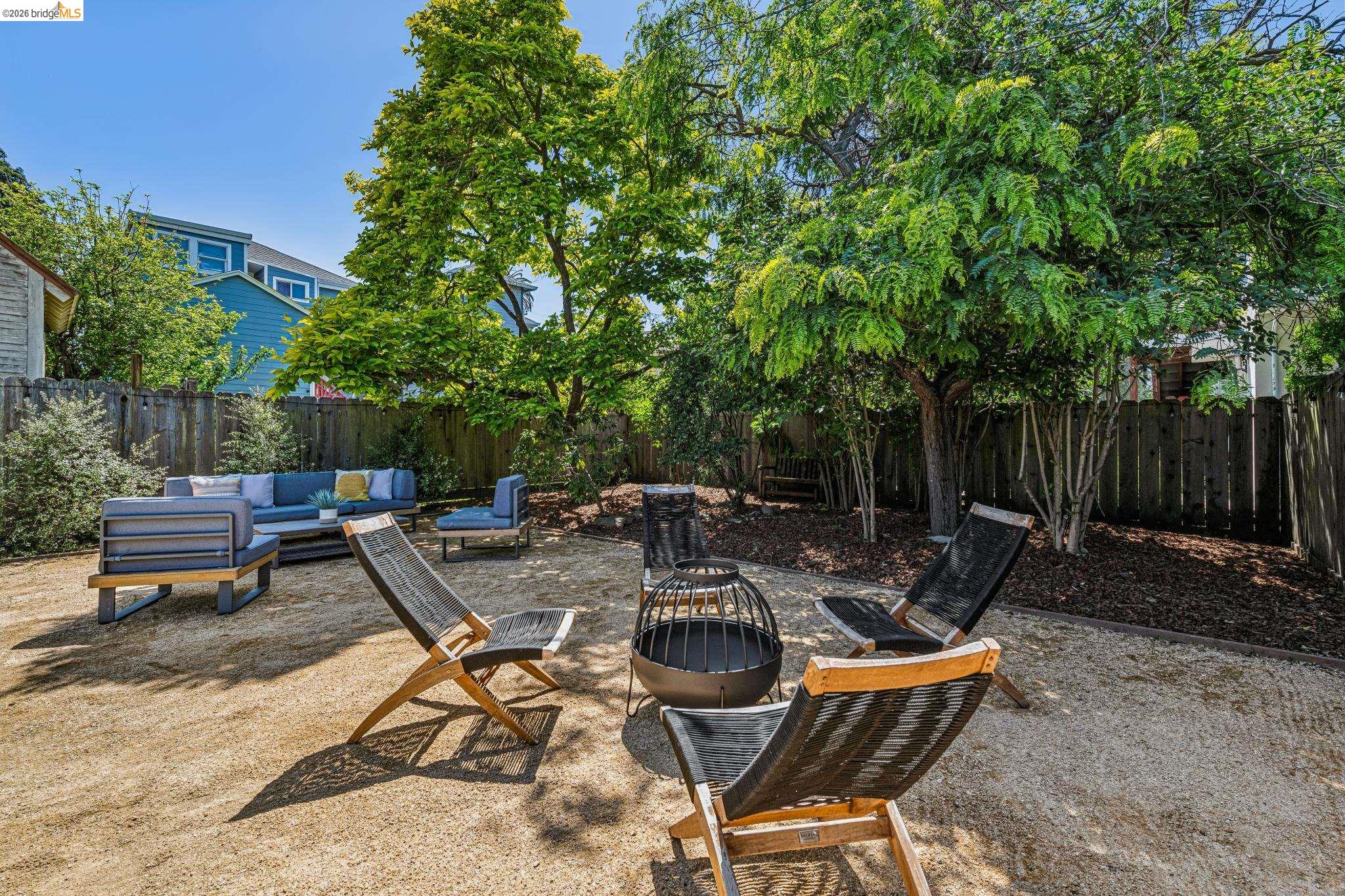 6521 Dover Street Berkeley, CA 94703 - Photo 59 of 80 Spacious outdoor area featuring a gravel ground cover and a wood privacy fence