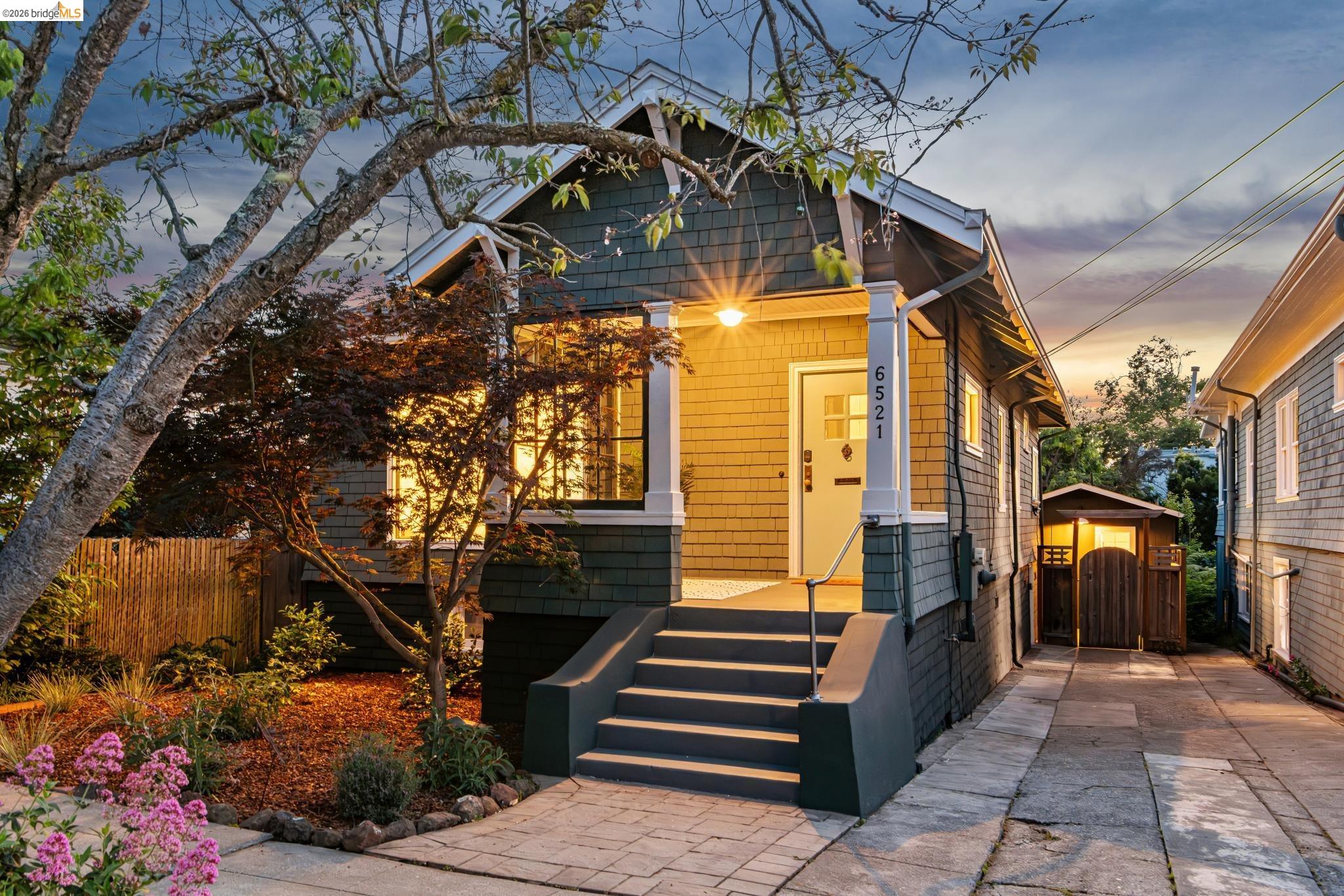 6521 Dover Street Berkeley, CA 94703 - Photo 61 of 80 Craftsman-style exterior featuring a covered porch with white pillars, shingle siding, and a paved driveway