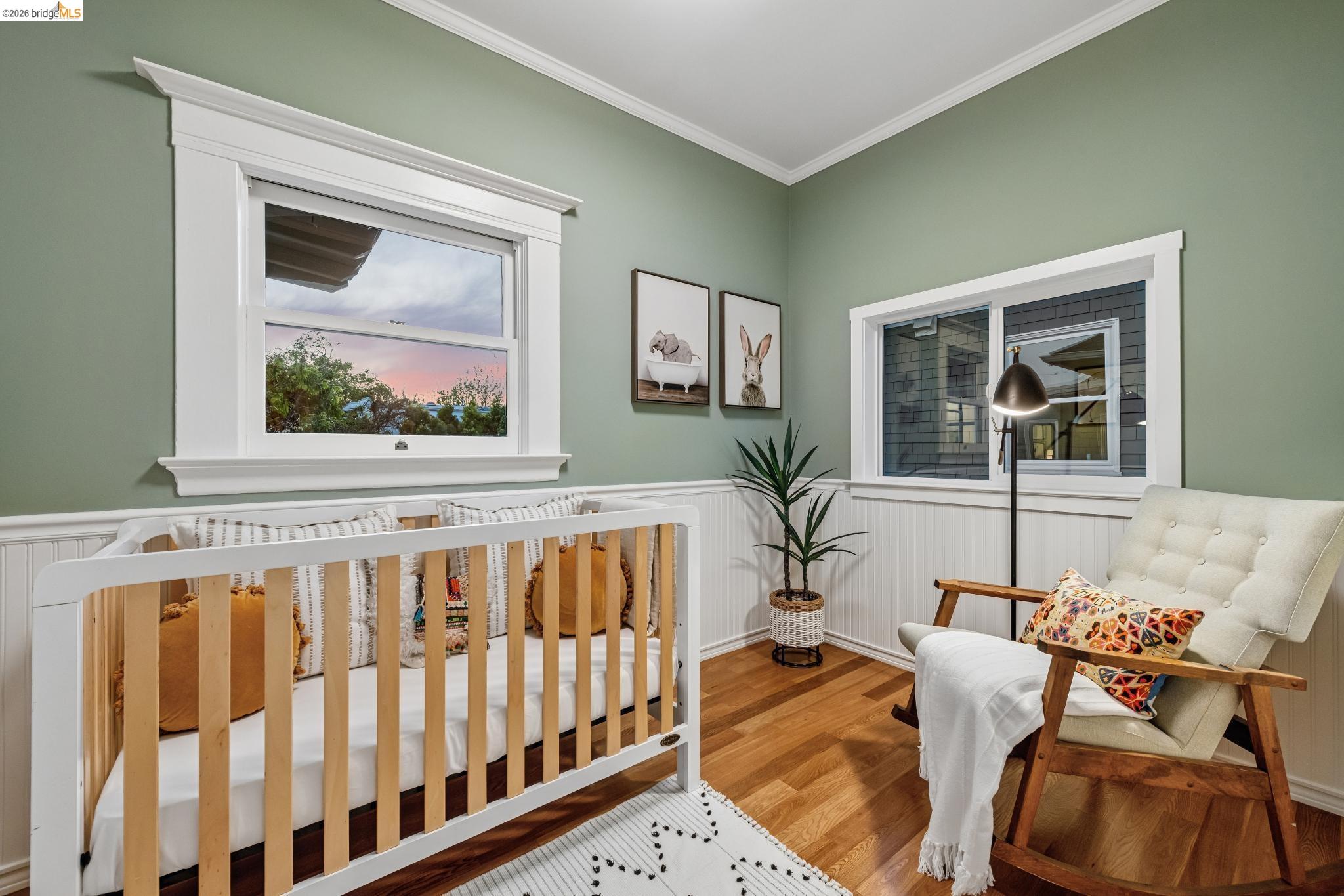 6521 Dover Street Berkeley, CA 94703 - Photo 67 of 80 Room featuring wood-finish flooring, two windows, and white beadboard wainscoting